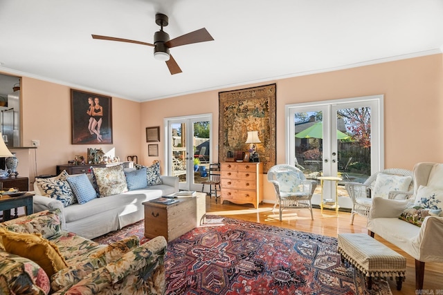 living room with french doors, hardwood / wood-style flooring, a wealth of natural light, and ceiling fan