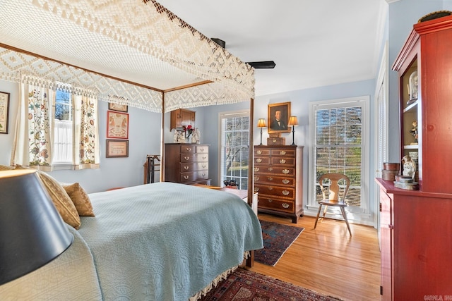 bedroom featuring ceiling fan and hardwood / wood-style floors