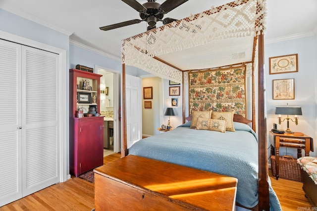 bedroom featuring hardwood / wood-style floors, ceiling fan, and ornamental molding