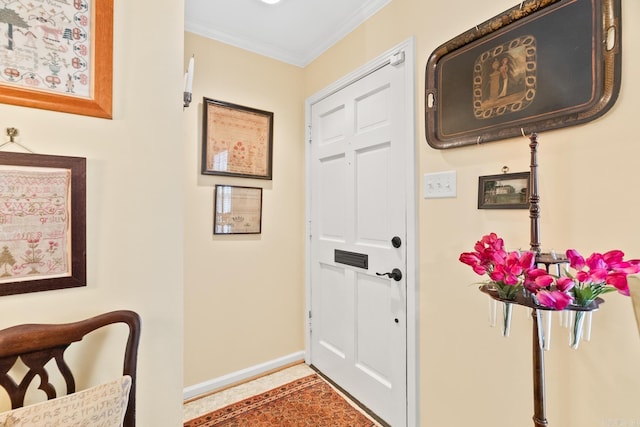 entryway featuring crown molding