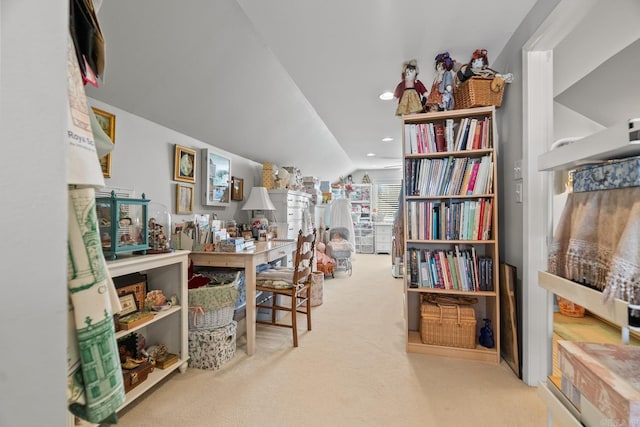 carpeted office with vaulted ceiling