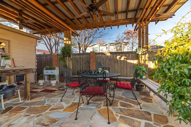 view of patio featuring ceiling fan