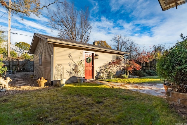 view of outdoor structure with a lawn