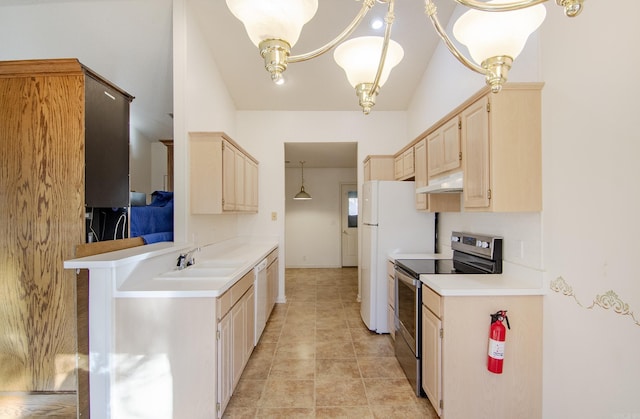 kitchen with lofted ceiling, white appliances, decorative light fixtures, a kitchen bar, and a chandelier