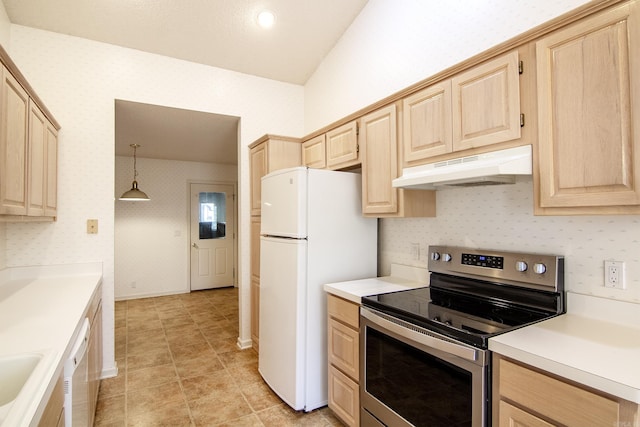 kitchen featuring light brown cabinets, stainless steel appliances, hanging light fixtures, and vaulted ceiling