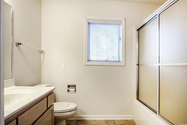 full bathroom featuring tile patterned flooring, combined bath / shower with glass door, a textured ceiling, toilet, and vanity