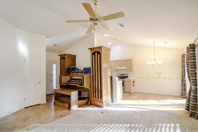 living room featuring a textured ceiling, ceiling fan with notable chandelier, light hardwood / wood-style floors, and high vaulted ceiling