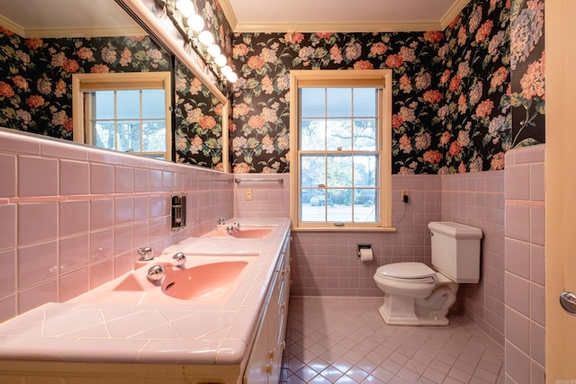 bathroom with tile patterned floors, a healthy amount of sunlight, and crown molding