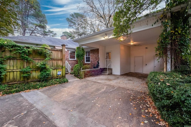 view of front of home featuring a carport