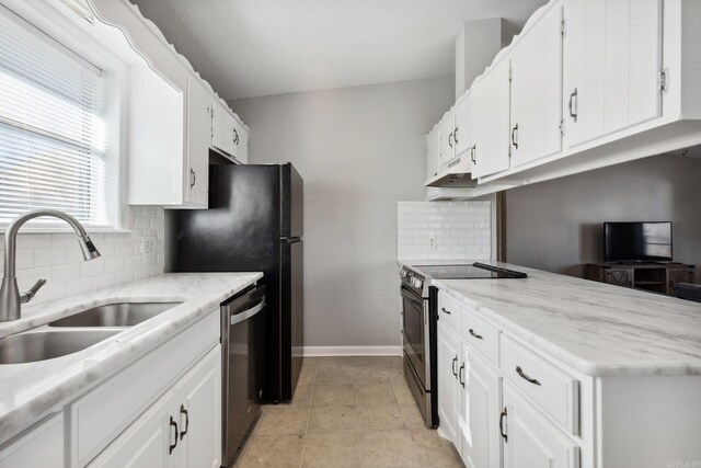 kitchen with white cabinets, decorative backsplash, sink, and appliances with stainless steel finishes