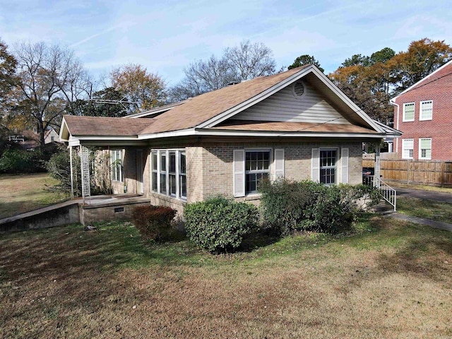 view of property exterior with a yard