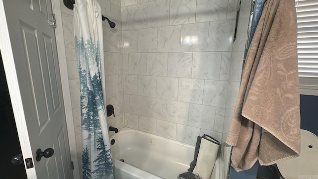 bathroom with shower / bath combination with curtain