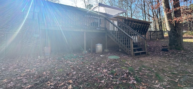 view of side of property with a wooden deck