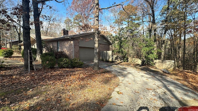 view of side of property featuring a garage