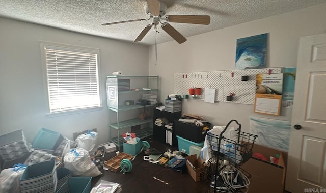 office space featuring ceiling fan and a textured ceiling