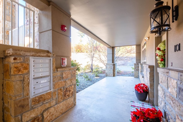 view of patio / terrace featuring a mail area