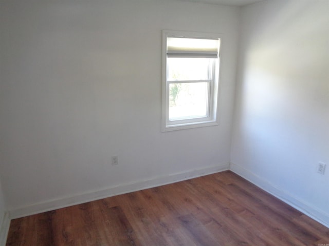 empty room featuring dark hardwood / wood-style floors