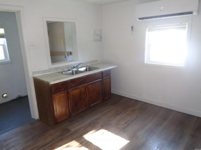 bathroom with an AC wall unit, vanity, backsplash, and hardwood / wood-style floors