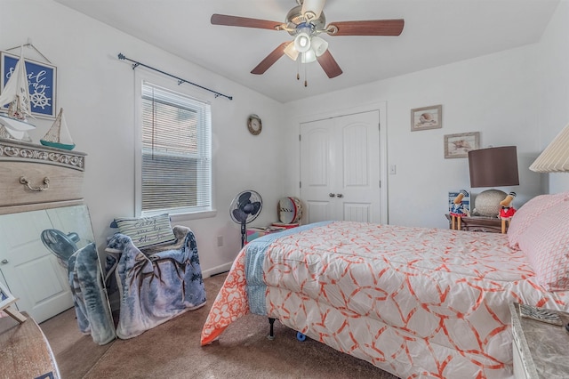 bedroom with carpet, ceiling fan, and a closet