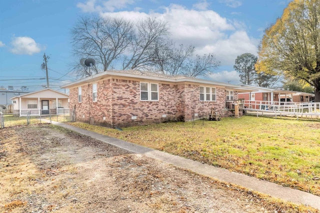 ranch-style house with a front lawn