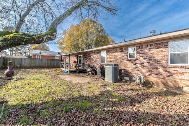 rear view of property featuring cooling unit