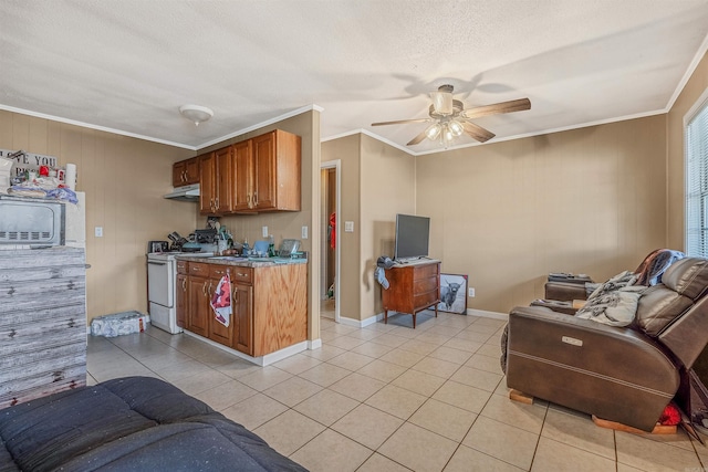 kitchen featuring light tile patterned flooring, white range oven, and ornamental molding