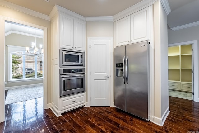 kitchen featuring white cabinets, appliances with stainless steel finishes, dark hardwood / wood-style floors, and a notable chandelier