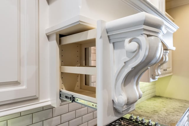 interior details featuring white cabinets