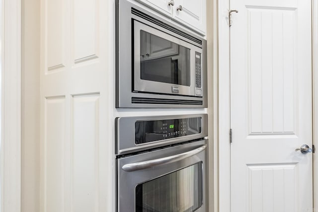 kitchen featuring white cabinets and appliances with stainless steel finishes