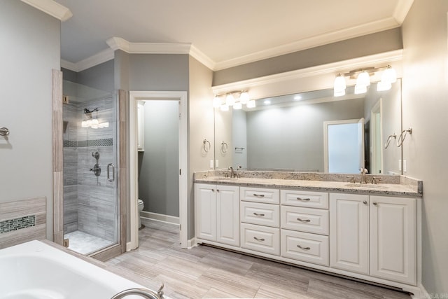 full bathroom with plus walk in shower, vanity, toilet, and ornamental molding