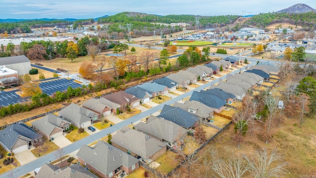 birds eye view of property with a mountain view