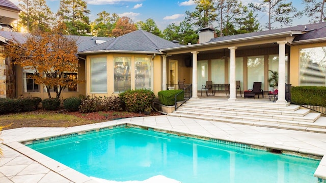 view of swimming pool with a patio