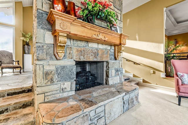 interior space with carpet, ornamental molding, and a fireplace