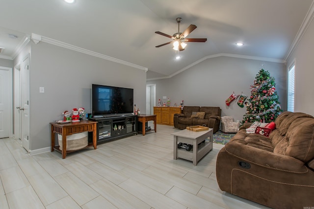 living room featuring vaulted ceiling, ceiling fan, and ornamental molding