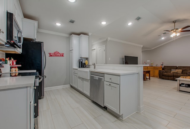 kitchen with stainless steel appliances, white cabinetry, and ceiling fan