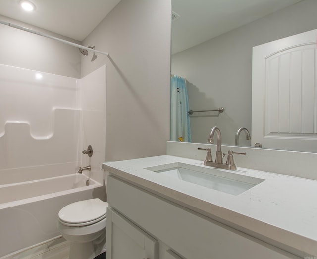 full bathroom featuring shower / bath combo with shower curtain, vanity, and toilet