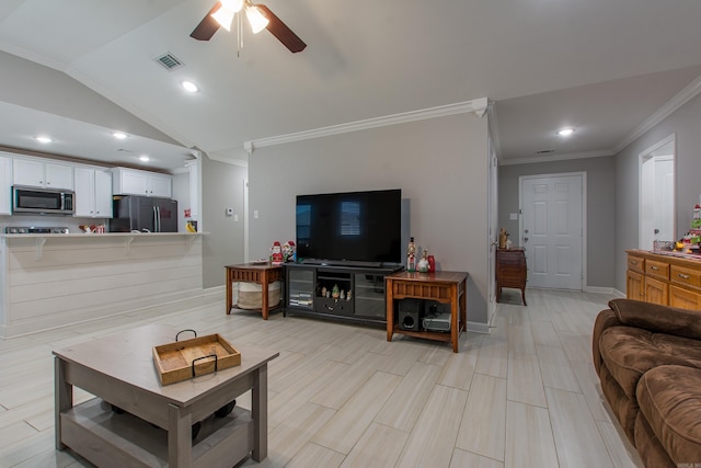 living room featuring ceiling fan, lofted ceiling, crown molding, and light hardwood / wood-style flooring