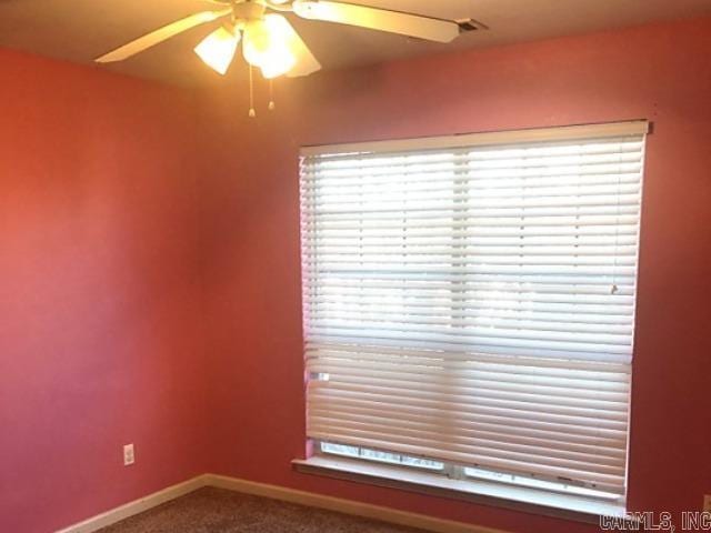 empty room with carpet flooring and ceiling fan