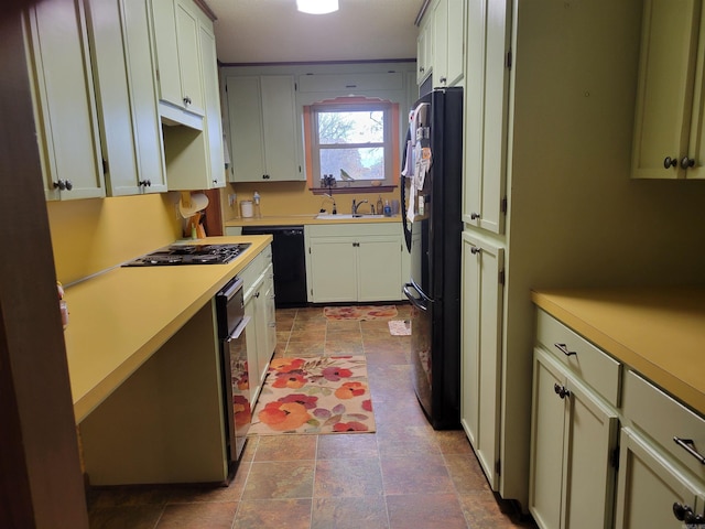 kitchen with sink and black appliances