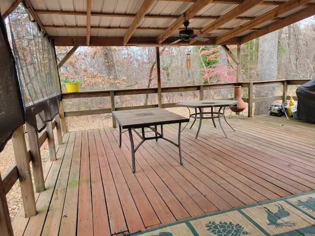 deck featuring a grill and ceiling fan