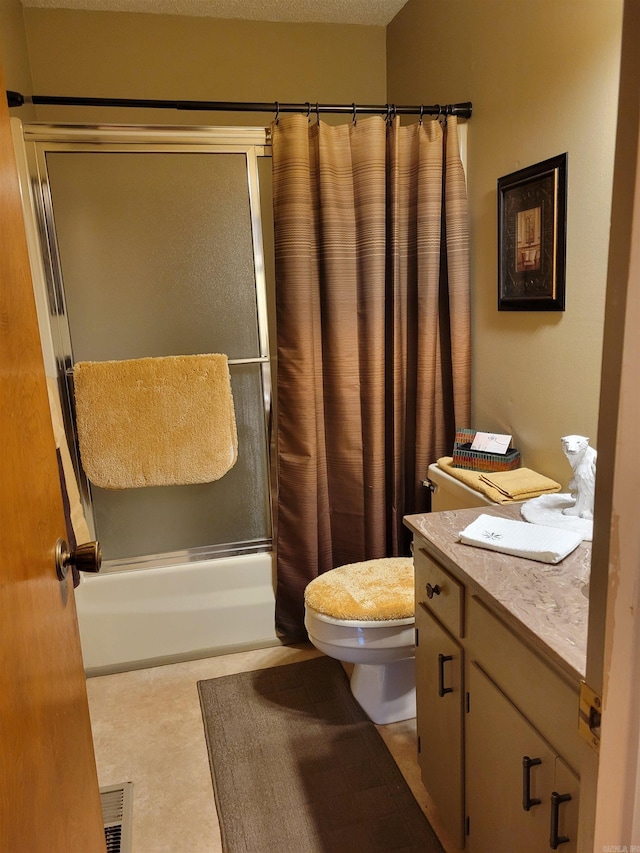 full bathroom with shower / bath combo with shower curtain, vanity, a textured ceiling, and toilet