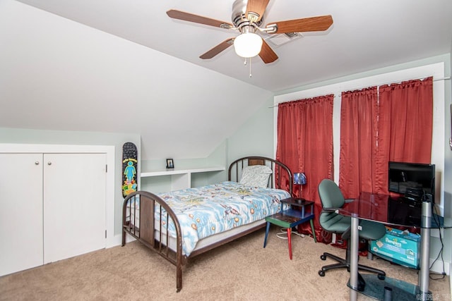 carpeted bedroom with ceiling fan and lofted ceiling