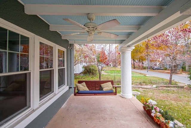 view of patio featuring ceiling fan and a porch