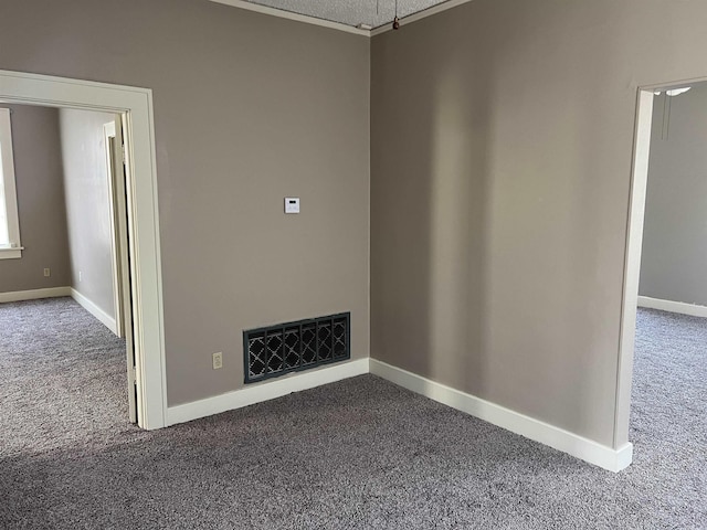 unfurnished living room with dark carpet