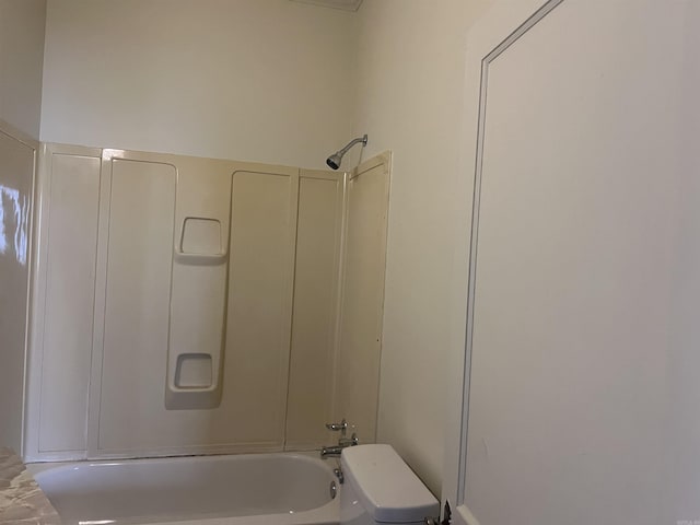 bathroom with toilet and shower / bath combination