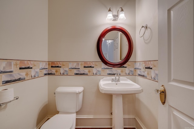 bathroom with toilet and sink