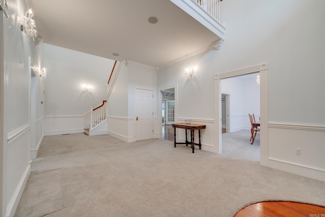 carpeted empty room with ornamental molding