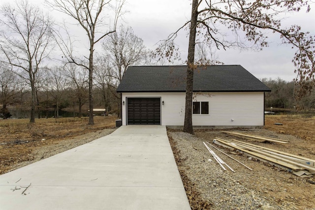 view of side of home with a garage