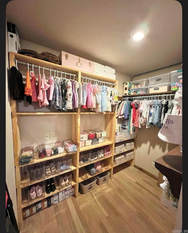 walk in closet featuring hardwood / wood-style floors