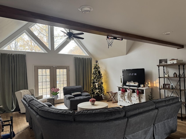 living room featuring beamed ceiling, ceiling fan, a healthy amount of sunlight, and hardwood / wood-style flooring